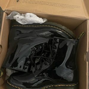 Dr. Marten’s black patent lamber boot womens size 10 used in great condition.